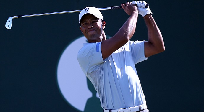 Tiger Woods tees off on the first during the second round of the 2013 Open Championship at Muirfield.