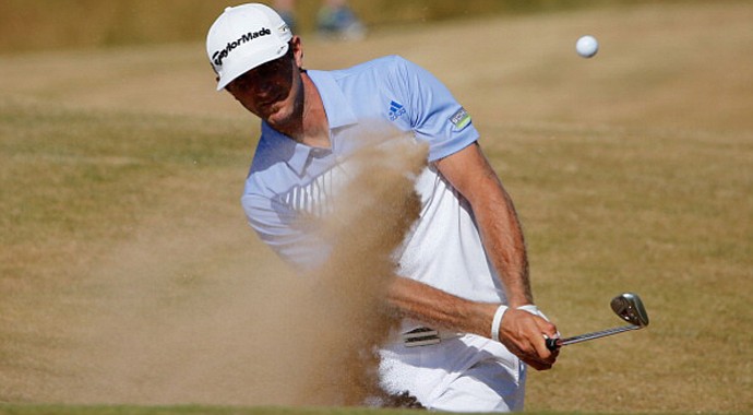 Dustin Johnson plays out of a bunker on the ninth hole during the second round of the Open Championship.