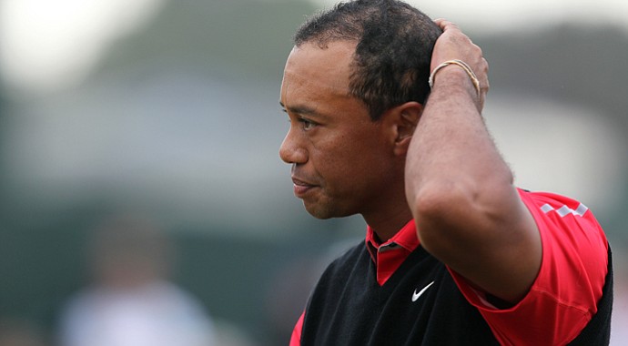 Tiger Woods looks worn out heading up the 18th fairway after a final-round, 3-over 74 that left him five shots back of Phil Mickelson at the Open Championship.