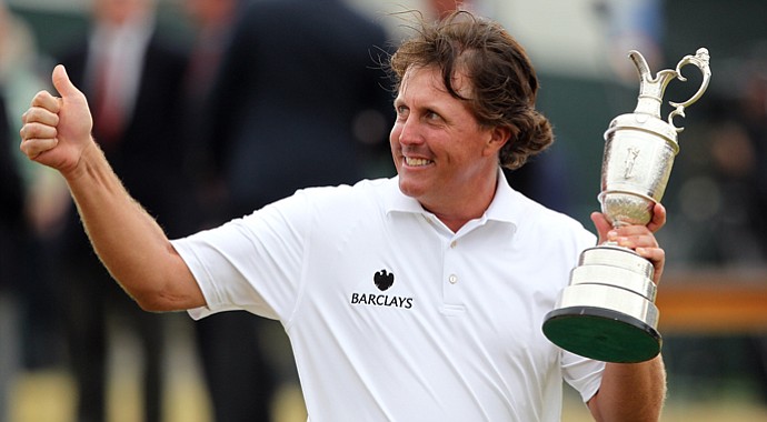 Phil Mickelson poses for pictures with the Claret Jug after winning the 2013 Open Championship at Muirfield.