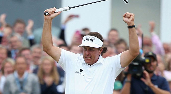 Phil Mickelson reacts to a birdie putt on the 18th hole during the final round of the 142nd Open Championship at Muirfield.