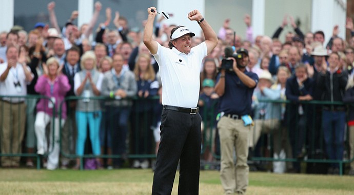 Phil Mickelson reacts after making a 12-footer for birdie on the 18th to get to the Muirfield clubhouse at 3 under. He'd go on to win by three shots over Henrik Stenson at the Open Championship.