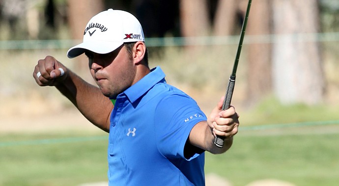 Gary Woodland celebrates after making a birdie putt on the 15th hole during the final round of the Reno-Tahoe Open.