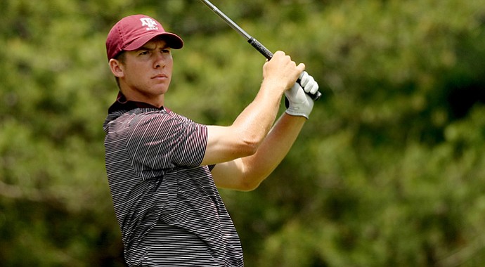 Ty Dunlap tees off during the final round of stroke play at the 2013 NCAA Championship at The Capital City Club's Crabapple course.