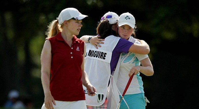 Leona Maguire, far right, hugs sister and caddie Lisa after defeating Stephanie Meadow, left.