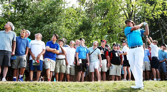 Jason Dufner plays a shot from the rough on the second hole during the final round of the 95th PGA Championship.