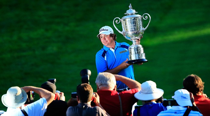 Jason Dufner poses for photographers with the Wanamaker Trophy after his two-stroke victory at the 95th PGA Championship at Oak Hill Country Club.