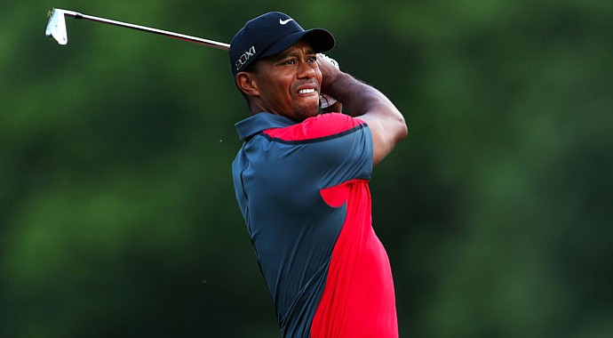 Tiger Woods hits his tee shot on the second hole during the final round of the 95th PGA Championship.