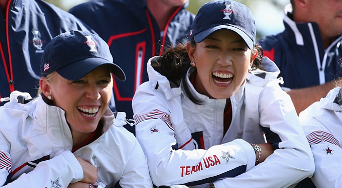 Morgan Pressel (left) and Michelle Wie share a laugh during a team photo shoot prior to the 2013 Solheim Cup at Colorado Golf Club.
