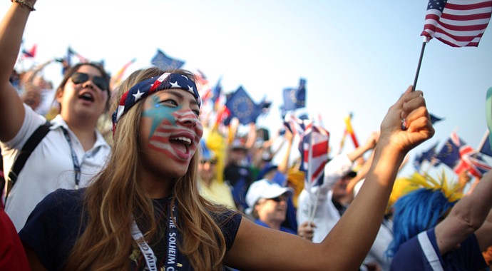 Fans support the U.S. team on the first tee during the morning foursomes matches at the 2013 Solheim Cup.