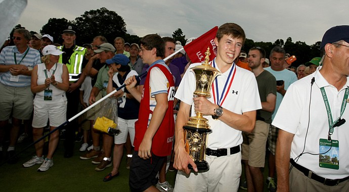 Matthew Fitzpatrick proudly holds the Havemeyer Trophy after defeating Oliver Goss, 4 and 3, at the 2013 U. S. Amateur at The Country Club.