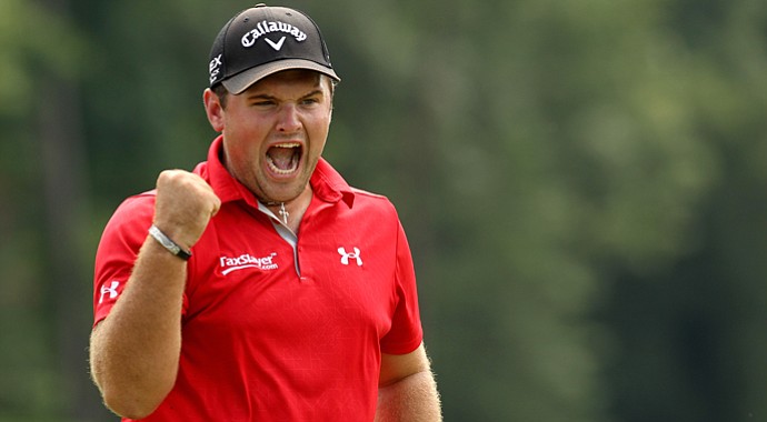 Patrick Reed celebrates after making a birdie to win on the second hole of a playoff against Jordan Spieth during the final round of the Wyndham Championship at Sedgefield Country Club.