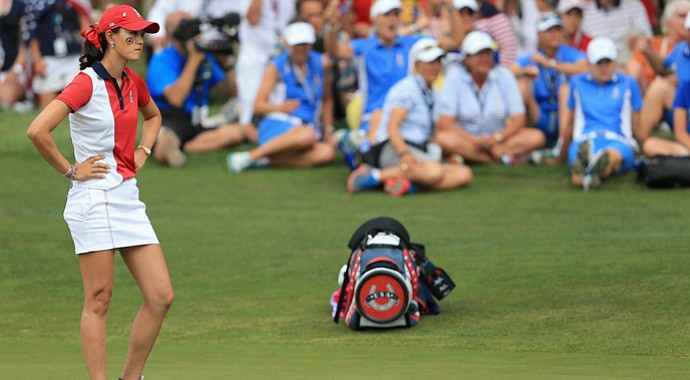 Michelle Wie of the United States team looks on as Caroline Hedwall of Sweden and the European team win the 16th hole to bring their match to all square during the final day singles matches of the 2013 Solheim Cup.