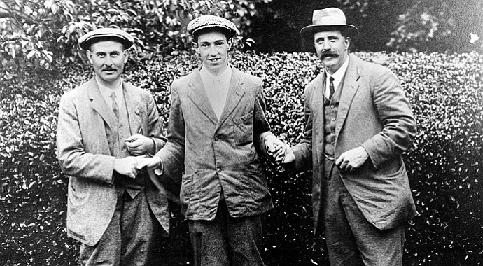 American golfer Francis B. Ouimet, center, shakes hands with Harry Vardon, left, and Ted Ray, both of Britain, at the U.S. Open Golf Championship at The Country Club in Brookline, Mass., in 1913. Ouimet defeated the pair to become the new champion.
