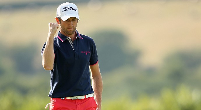 Gregory Bourdy celebrates after holing a birdie putt on the 17th green on his way to victory in the ISPS Handa Wales Open.