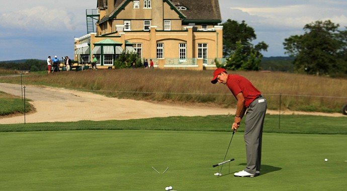 USA's Patrick Rodgers putts on the practice green during the 2013 Walker Cup at National Golf Links of America in Southampton, N.Y.