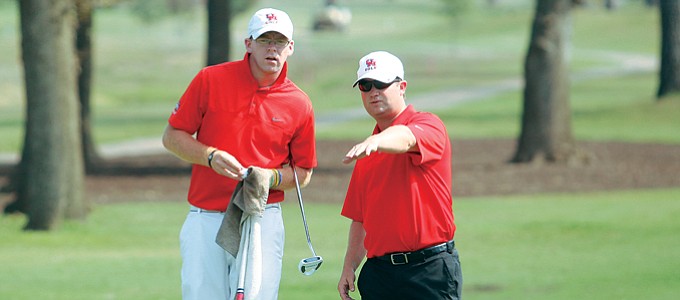 Houston coach Jonathan Dismuke (right) and senior Bryn Flanagan.