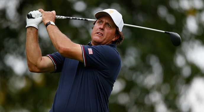 Phil Mickelson of the U.S. watches his tee shot on the sixth tee during the Day 1 four-ball matches.