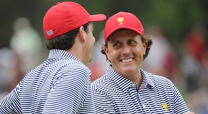 Phil Mickelson of the U.S. smiles at teammate Keegan Bradley during the Day 2 foursomes matches at the Presidents Cup.