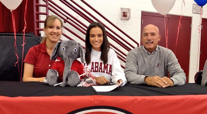 Nicole Morales (center) signs with Alabama.