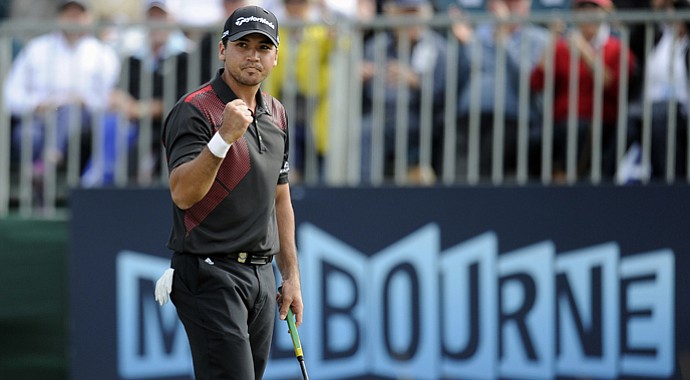 Jason Day celebrates on the 18th green after winning the World Cup of Golf tournament at Royal Melbourne Golf Course in Australia.