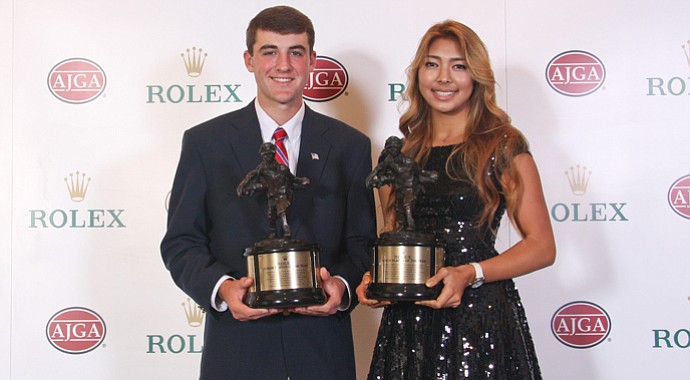 Scottie Scheffler and Alison Lee with their AJGA Rolex Player of the Year trophies.