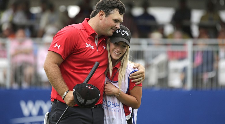 Patrick Reed and Justine Reed celebrate their victory at the Wyndham Championship, one of 44 events she was on her husband's bag. She is taking time off with the couple's first child expected to be born in May.