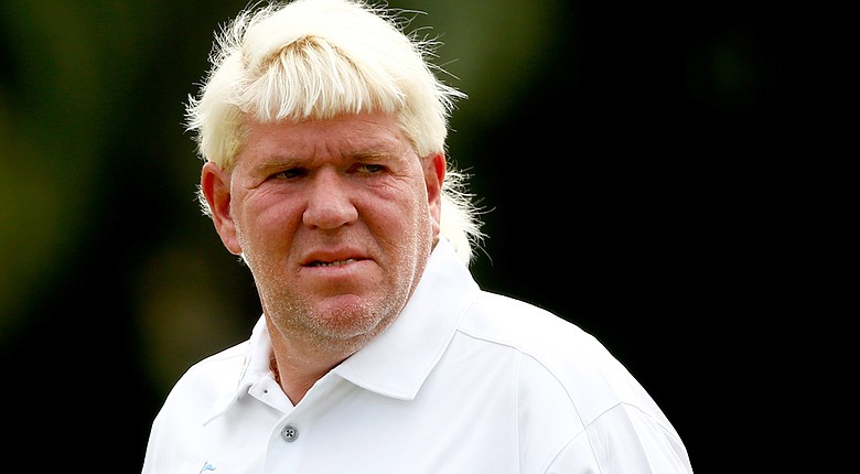 John Daly made the cut at the Sony Open, but says he reinjured his surgically repaired elbow during a bunker shot on the 12th hole.