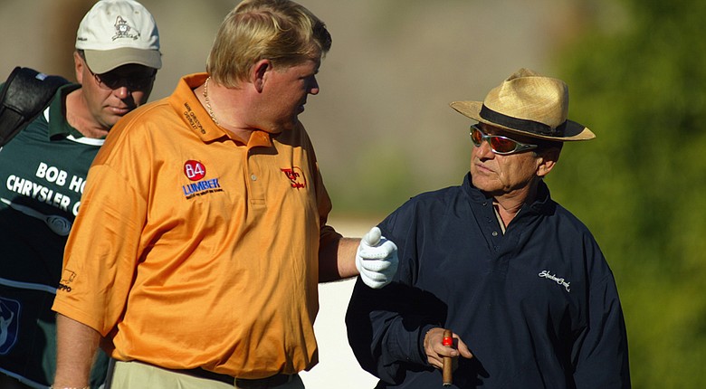 John Daly chats with actor Joe Pesci during the second round of the Bob Hope Chrysler Classic on January 30, 2003.