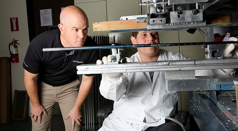 Don Brown (left, with silk screener Arturo Banuelos), with an undergraduate degree in metallurgical engineering and masters degree in materials engineering, was working on a doctorate when he decided to step into the working world with True Temper.