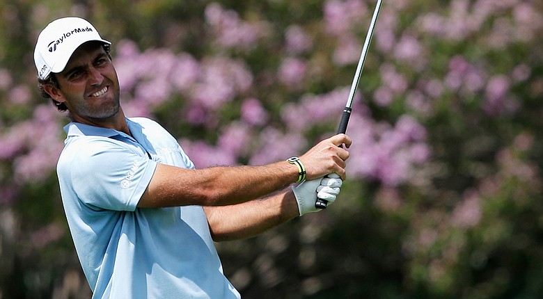 Edoardo Molinari hits his second shot on the 18th hole during the second round of the Joburg Open.