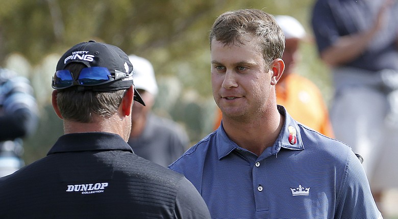 Harris English, right, after his win over Lee Westwood, left, in the first round of the 2014 WGC-Accenture Match Play at Dove Mountain in Marana, Ariz.