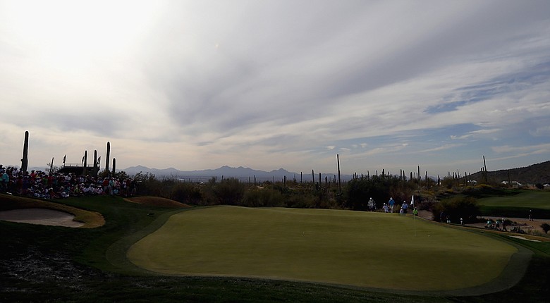 General view of Ernie Els and Jason Dufner walking to the green on the 18th hole after their third-round match at the WGC-Accenture Match Play Championship.