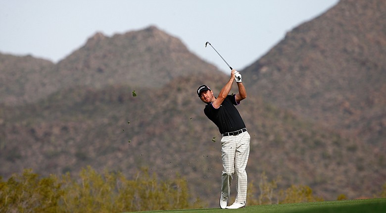Graeme McDowell plays a shot on the 19th hole during the third round of the WGC-Accenture Match Play Championship.