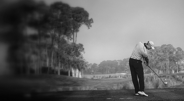 (Editors note: This image has been enhanced with the use of digital filters) Tiger Woods plays a shot during the pro-am prior to the start of the Honda Classic at PGA National Resort.