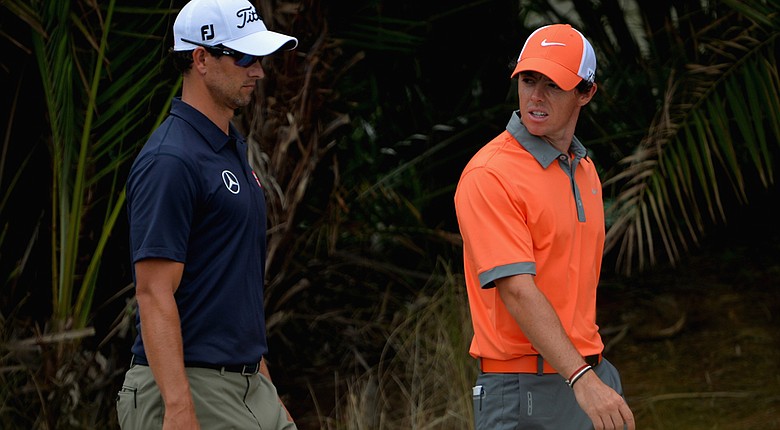 Adam Scott, left, and Rory McIlroy during their first round at the PGA Tour's Honda Classic at PGA National in Palm Beach Gardens, Fla.