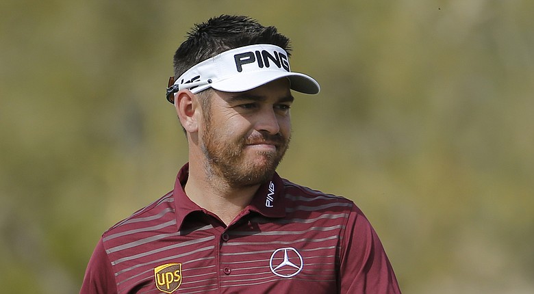 Louis Oosthuizen has been testing his ailing back at Trump National Doral to see if he can play in this week's 2014 WGC-Cadillac Championship; he felt pain at the WGC-Accenture Match Play (shown here).