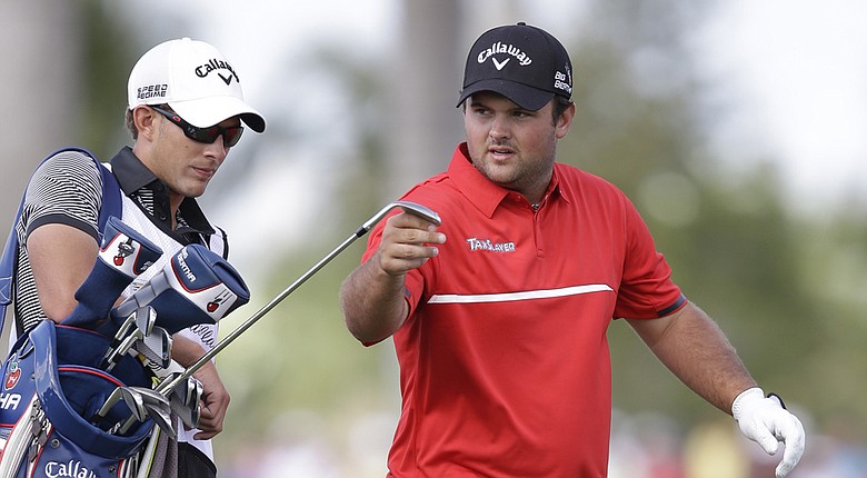 Patrick Reed with caddie Kessler Karain during his win at the 2014 WGC-Cadillac Championship, his third PGA Tour victory.