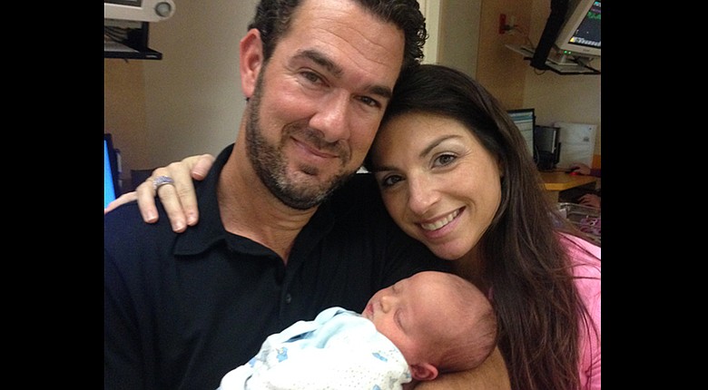PGA Tour caddie, Paul Tesori, and his wife, Michelle, leave the ICU with son, Isaiah.