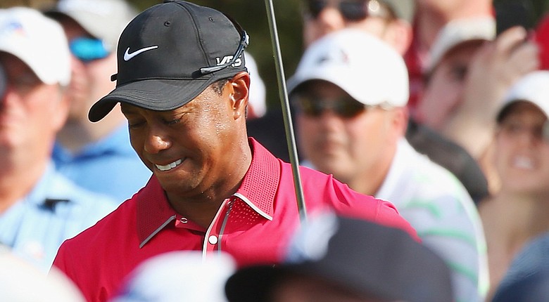 Tiger Woods withdrew from the Arnold Palmer Invitational on Tuesday, citing lingering back spasms.