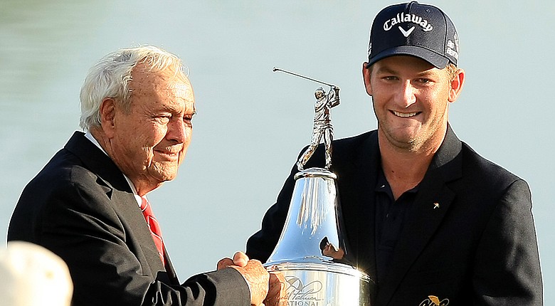 After his first PGA Tour victory, Matt Every accepts the trophy from Arnold Palmer at his namesake invitational at Bay Hill Club and Lodge in Orlando, Fla.