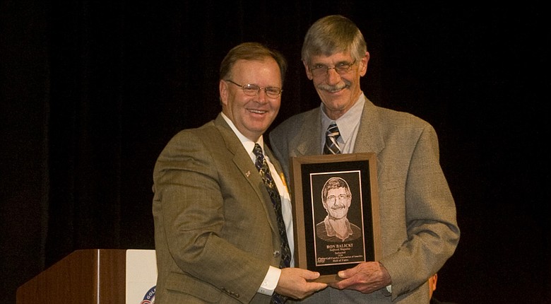 Ron Balicki (right) was the first non-coach inducted into the GCAA Hall of Fame in 2010, shown here with BYU head coach Bruce Brockbank.