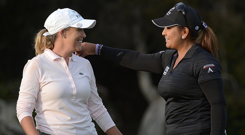 Co-leaders Cristie Kerr (left) and Lizette Salas embrace on the 18th hole after the third round of the Kia Classic in Carlsbad, Calif.