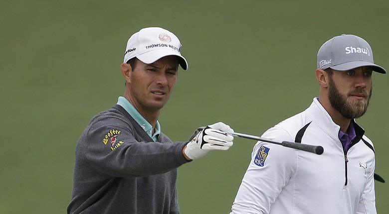 Mike Weir, left, and fellow Canadian Graham DeLaet during a Tuesday practice round for the 2014 Masters at Augusta National.