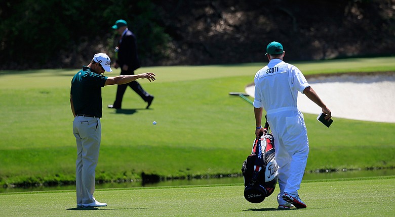 Adam Scott picked up a double bogey on the par-3 12th hole after finding the water in front of the green.