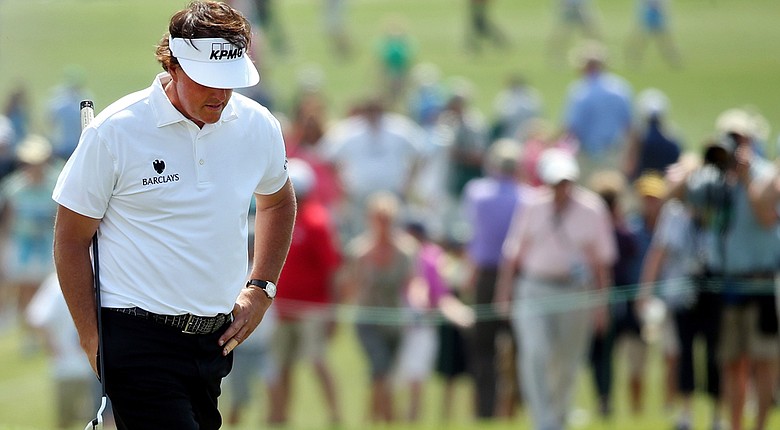 Phil Mickelson followed an opening-round 76 with a 1-over 73 on Friday to miss the cut by one shot at Augusta National.