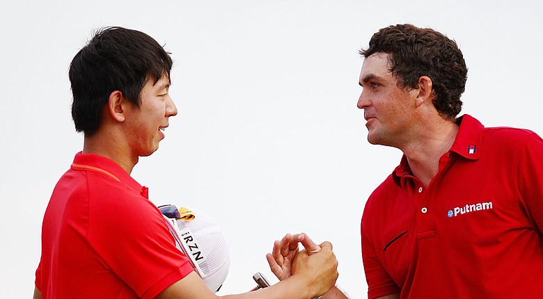 Seung-Yul Noh celebrates his two-shot victory at the Zurich Classic with a handshake from Keegan Bradley.