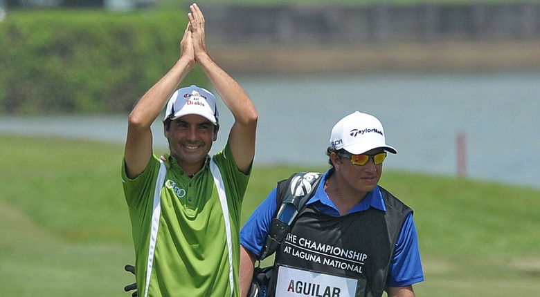 Felipe Aguilar celebrates after holing out on the final hole to win the European Tour's 2014 Championship at Laguna National in Singapore.