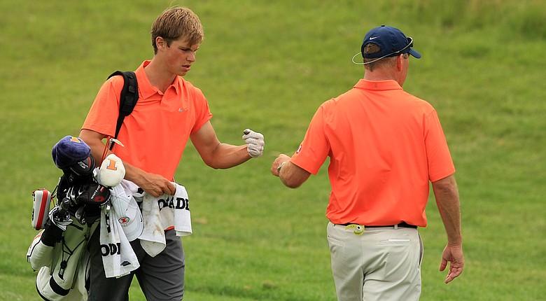 Thomas Detry of Illinois with head coach Mike Small at No. 18 on Monday of the NCAA Men's Division 1 Championship at Prairie Dunes Country Club in Hutchinson, Kan.