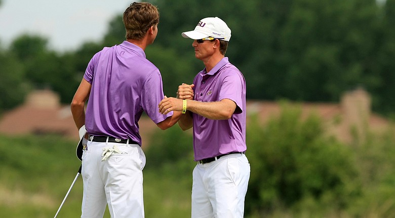 LSU assistant coach, Garrett Runion, hugs his player Smylie Kaufman as LSU defeated UCLA during Tuesday quarterfinals of match play of the NCAA Men's Division 1 Championship at Prairie Dunes Country Club in Hutchinson, Kan.